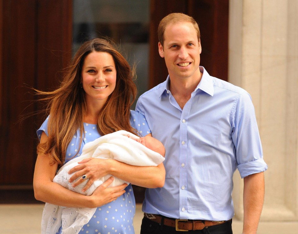 The Duke and Duchess of Cambridge holding their first child, Prince George, outside St Mary’s Hospital