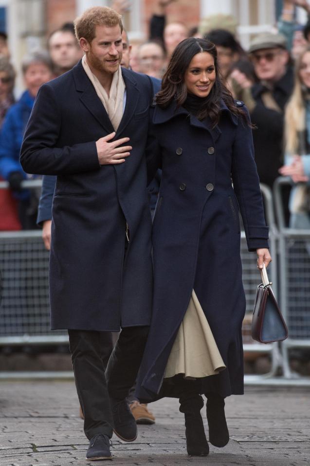  Meghan matching husband-to-be Harry in a navy full length double breasted coat for the First Royal Visit, 2017