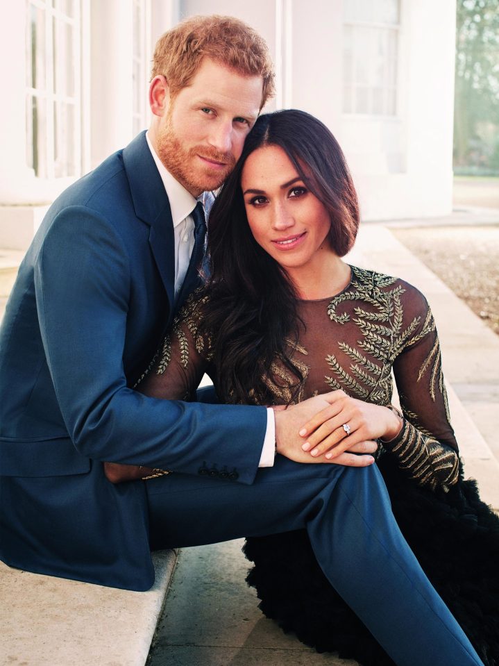  Meghan shows of her sparkler in a picture released to mark their engagement