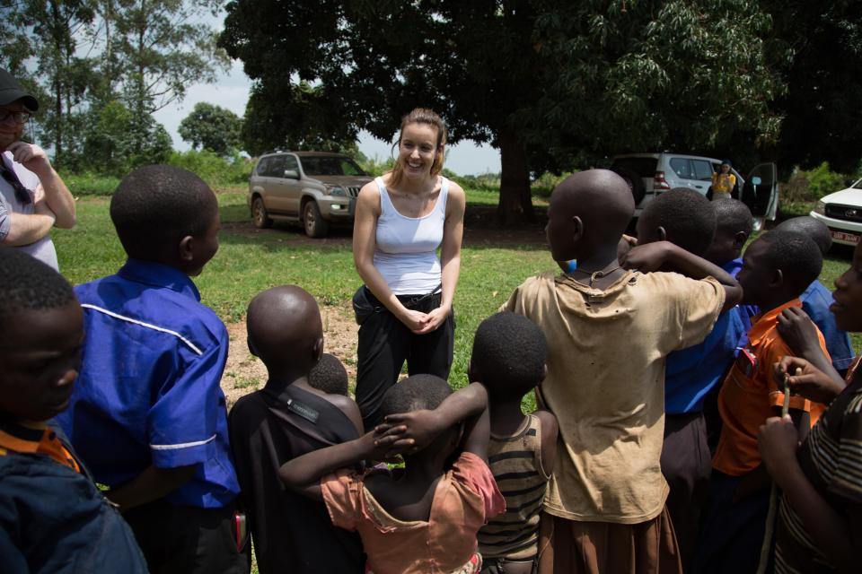  Locals gather to listen to Charlie and her battle against malaria