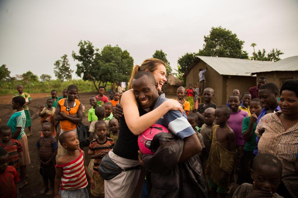  Charlie hugs 29-year-old Pharaoh Kasyonga