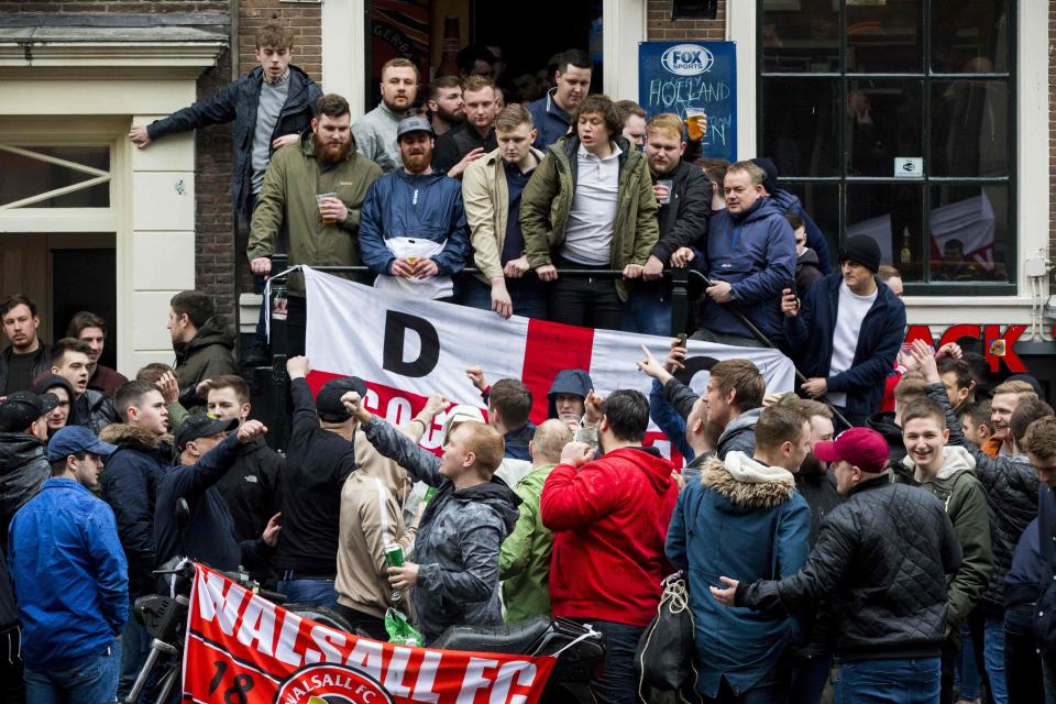  Sections of the travelling England fans were blasted for causing mayhem in Amsterdam