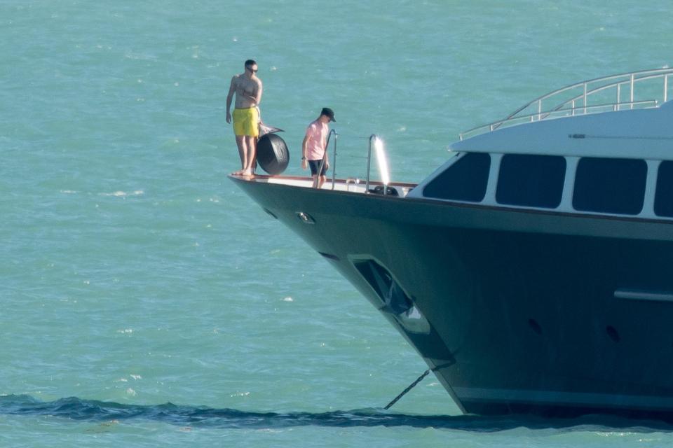  Daring Brooklyn teetered on the front of the yacht ready to plunge into the ocean below