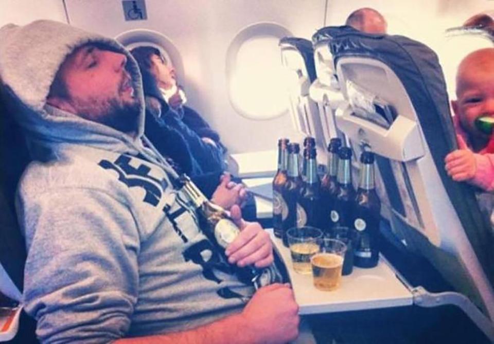 The baby pictured in the right corner cannot believe this passenger necked all of these beer bottles