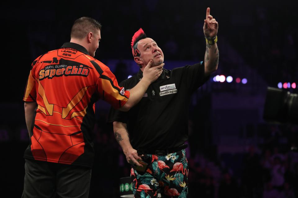 Peter Wright pointed to the heavens during his match at the Echo Arena on Thursday