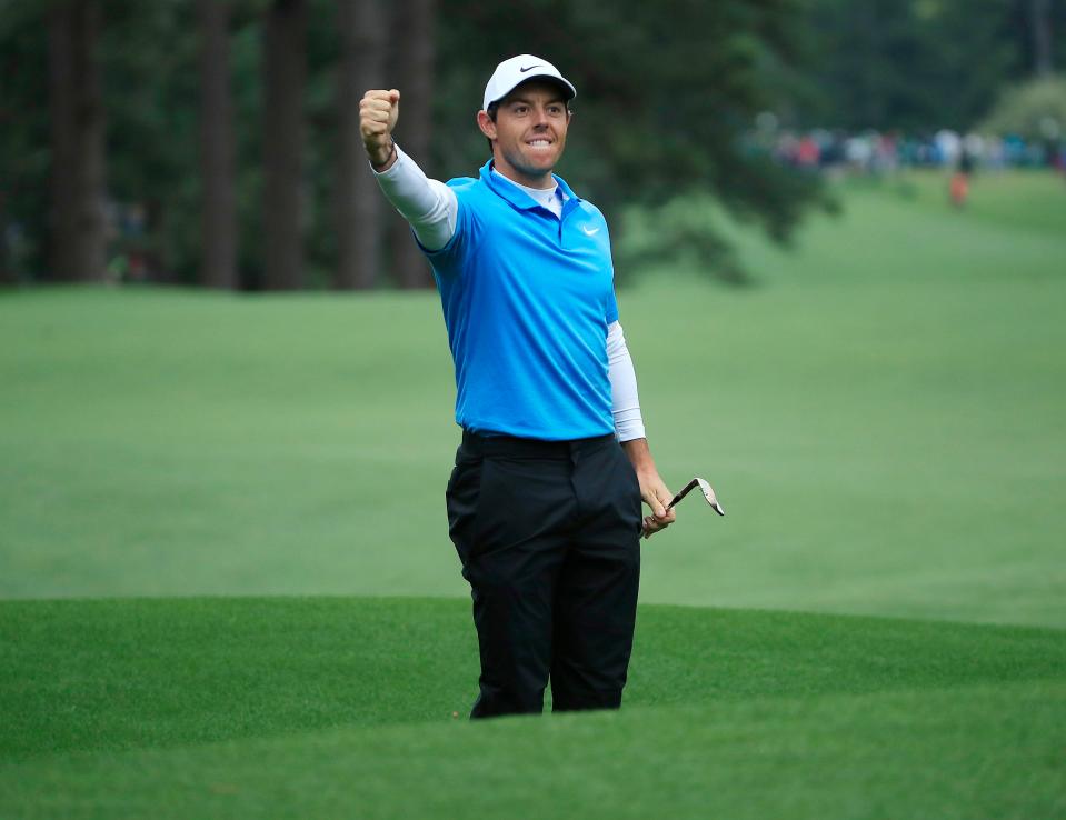 Rory mcIlroy fist pumps after a stunning eagle on the 8th hole during the third round of the Masters