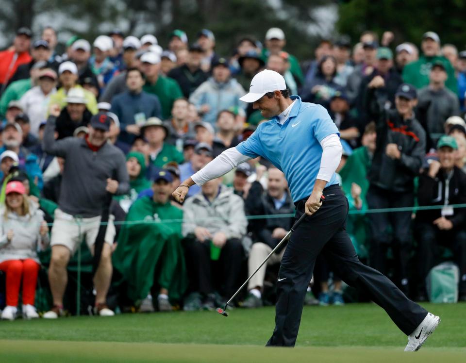 McIlroy shows his delight at making a birdie on the 18th