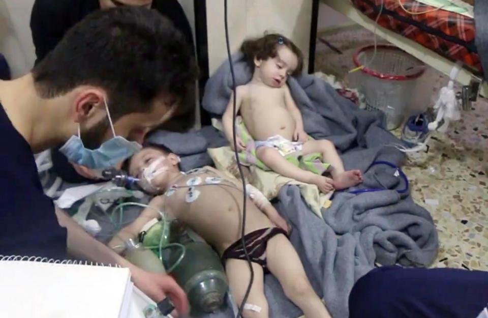  Medical workers treating toddlers following the alleged poison gas attack