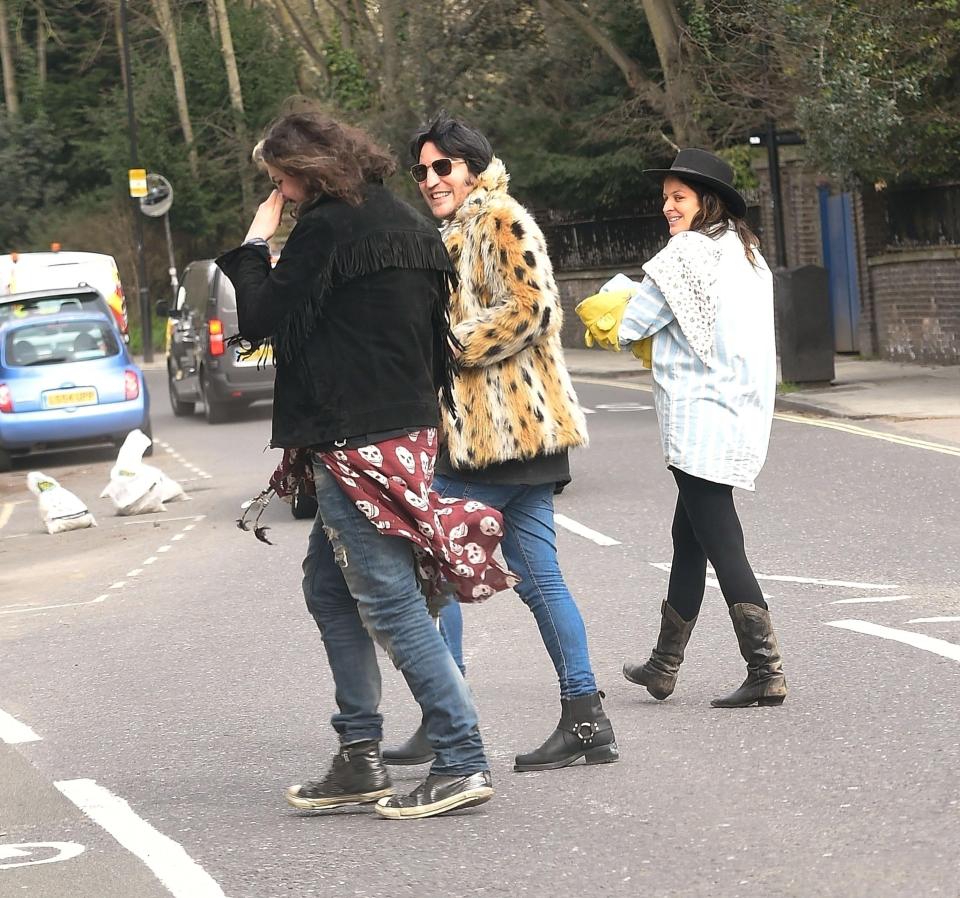  They all had smiles on their faces as they crossed the road together