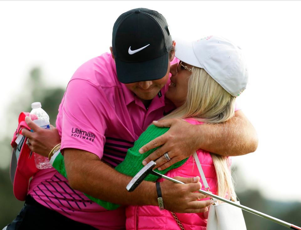  Patrick Reed hugs wife Justine after winning the Masters