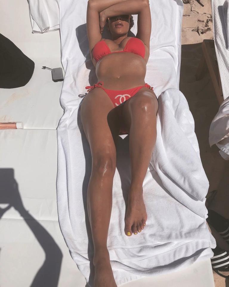 Kim showed off her stunning figure while sunbathing on holiday 