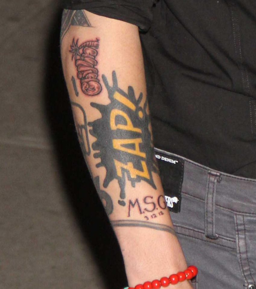  Zayn's inking allegedly represents his love for comic books, but many have speculated it was a tribute to his ex-girlfriend Perrie Edwards