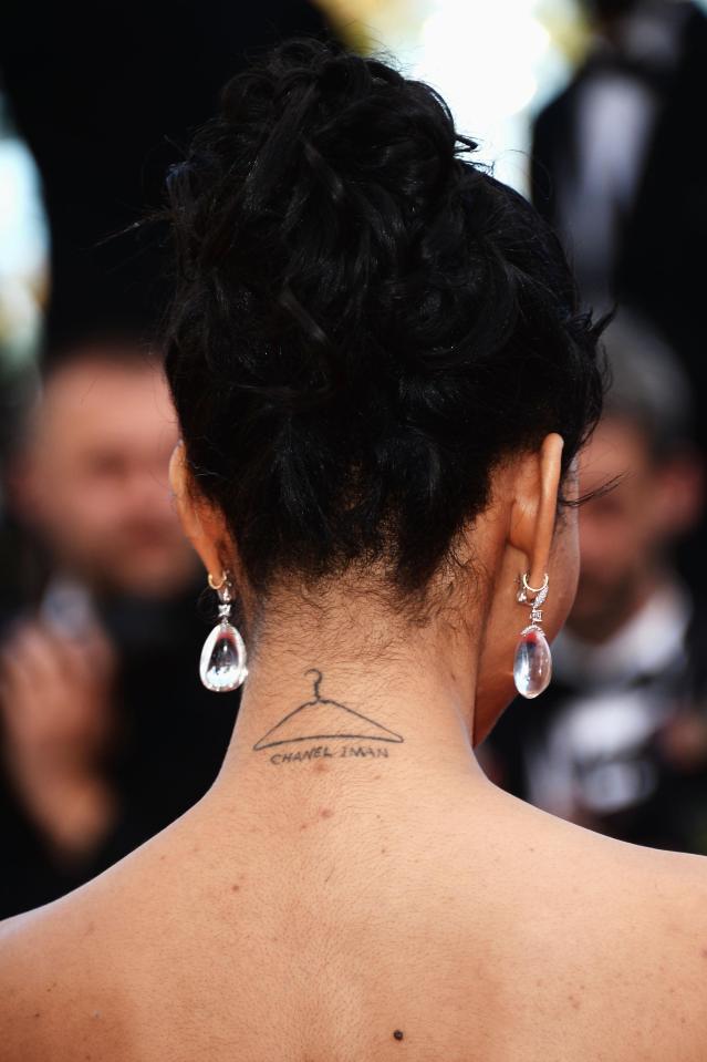  Chanel Iman showed off her clothes hanger tattoo with her own name below it, which could prove useful if she ever forgets her name