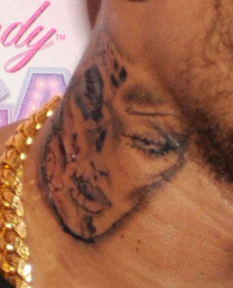  This Rihanna inking on the neck of Chris Brown looks nothing like the beautiful popstar