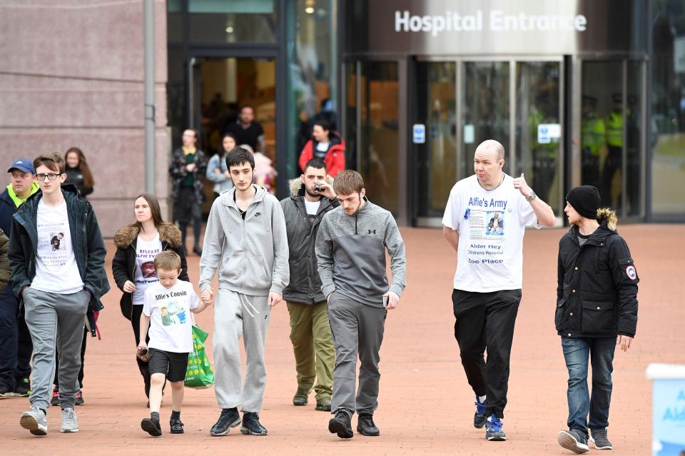  Tom, centre, seen leaving Alder Hey Children's Hospital to address the media