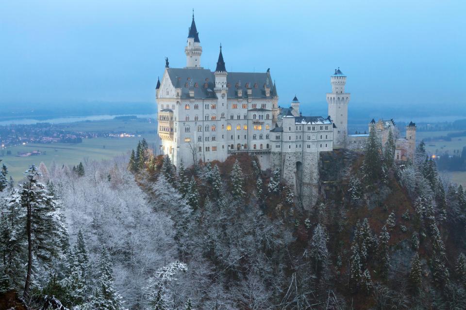  The castle has an impressive view from the top of a hill in Bavaria