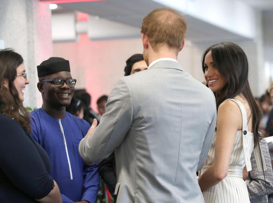  Guests marvel at the couple, as they enjoy the reception at Queen Elizabeth II Conference Centre