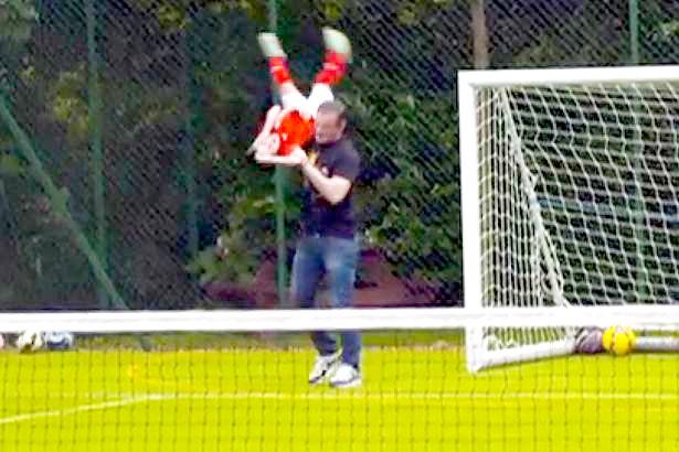  Wayne Rooney grabs son Kai on his garden pitch