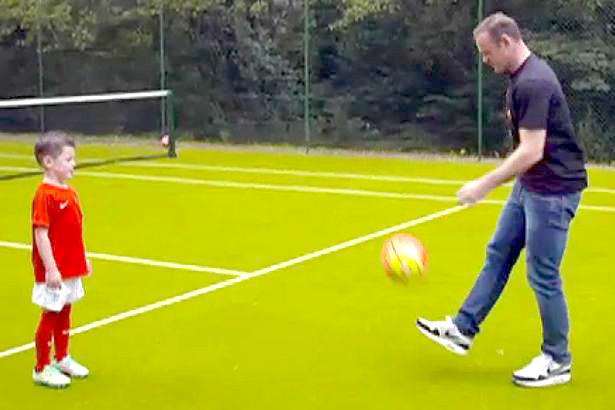  Wayne and Kai Rooney play on the pitch which also doubles as a tennis court