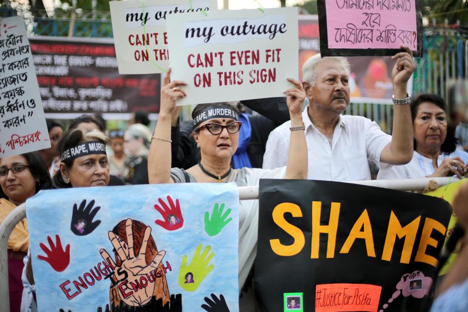  Indian actress and director Aparna Sen stand activists from various organization hold candles during a silent protest campaign against the rape and murder of an eight-year-old girl in Kathua