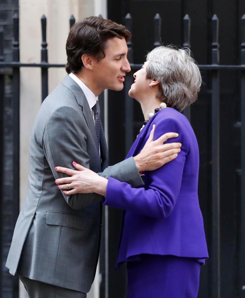  Sealed with a kiss: Theresa May and Justin Trudeau yesterday