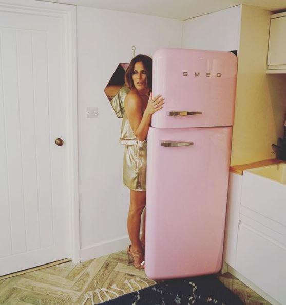  The pink fridge is pretty iconic on her Instagram