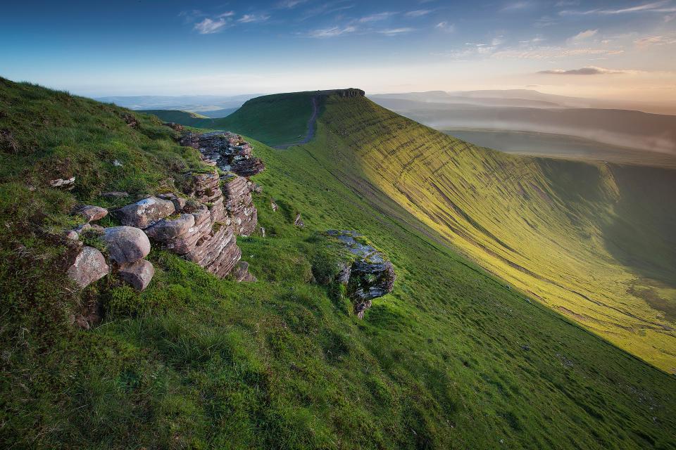  The sunlit summits and valleys of the Brecon Beacons, where wild horses roam and larks sing