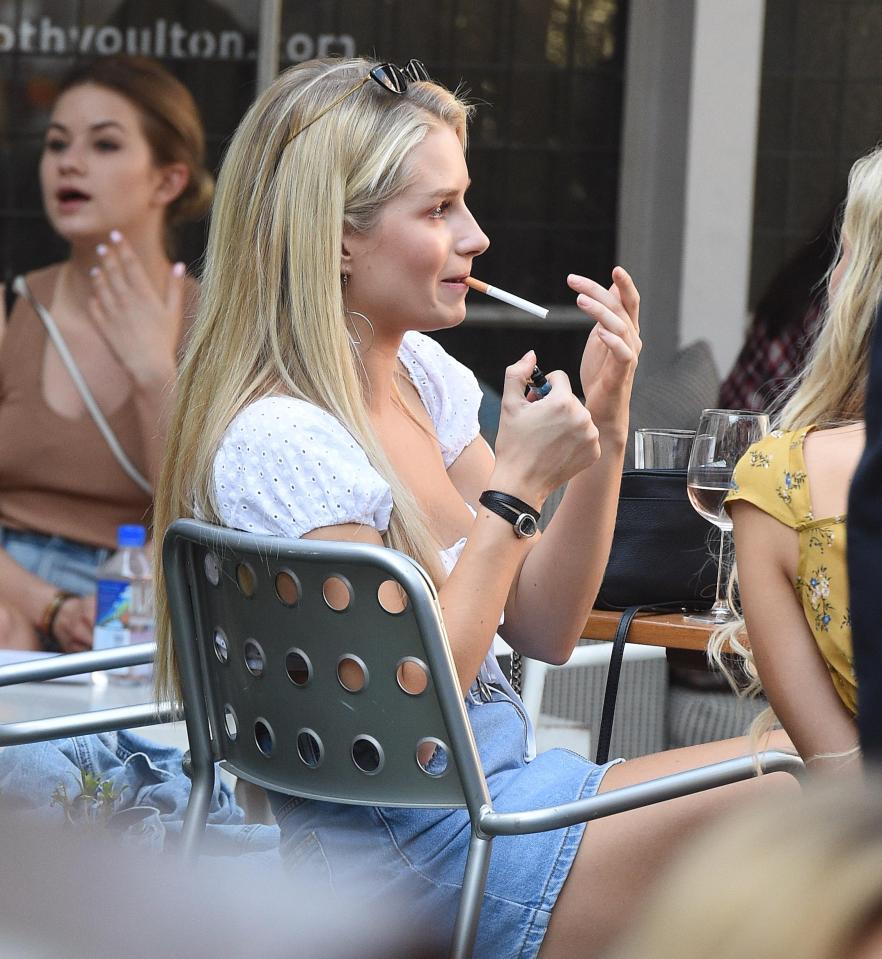  She was also seen lighting a cigarette alongside George Lineker, Tina Stinnes and Tom Dolemore