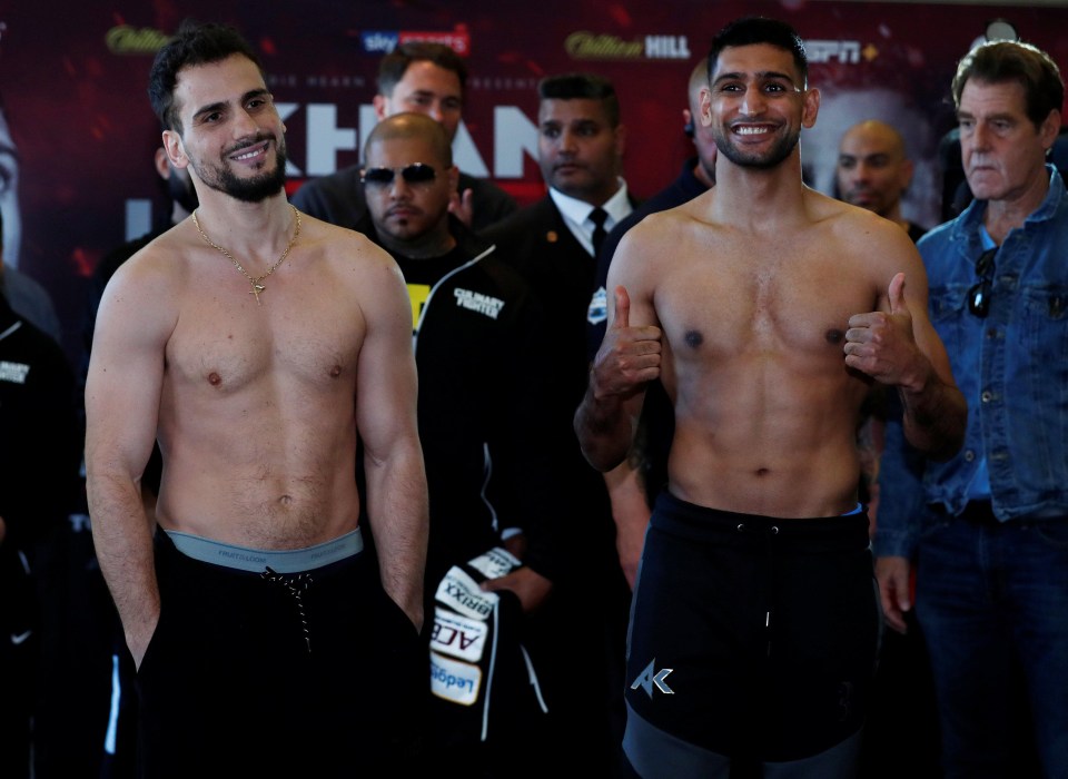 Two-time world champion Amir Khan weighed in just under the limit ahead of his comeback bout with Phil Lo Greco