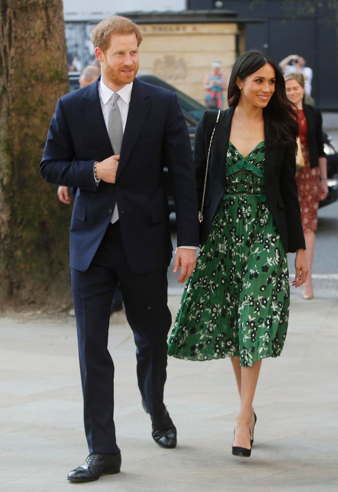  Earlier in the day Meghan opted for a £300 Self-Portrait dress and black suede Manolo Blahnik's