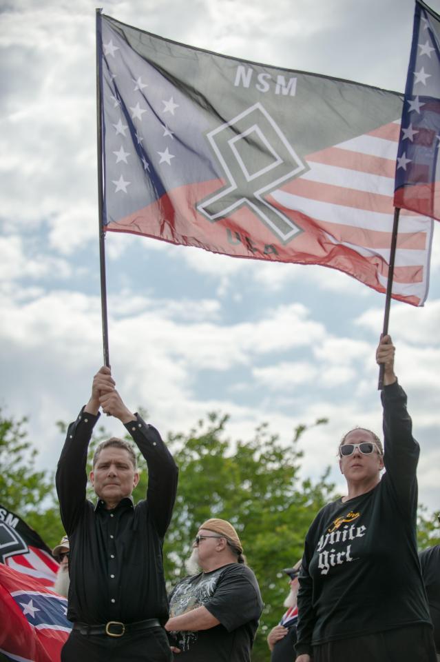  Several waved flags with neo-Nazi symbols