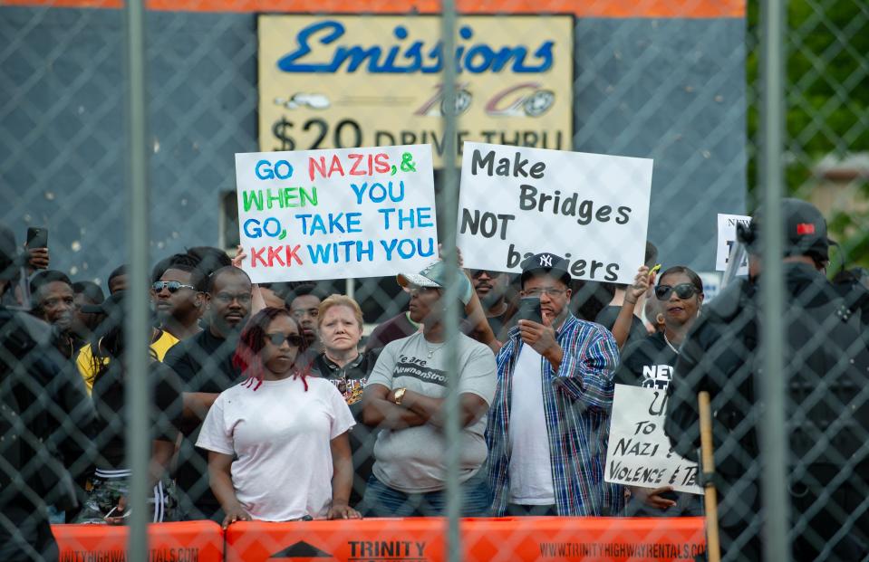  They waved signs and chanted 'racists not welcome'