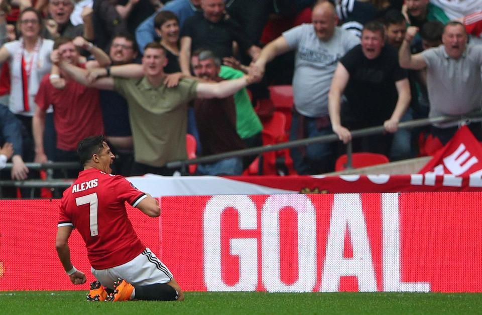  The Chile ace celebrates after scoring United's opener against Tottenham