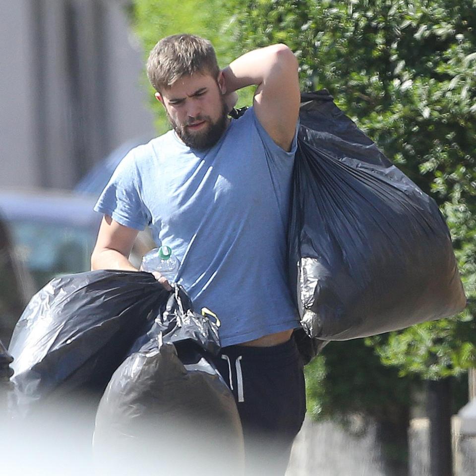  Tom struggled with bin liners full of belongings