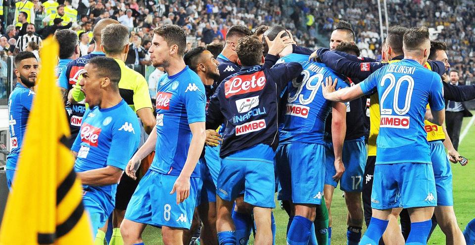 Napoli's players swamped Koulibaly after he headed home the winner