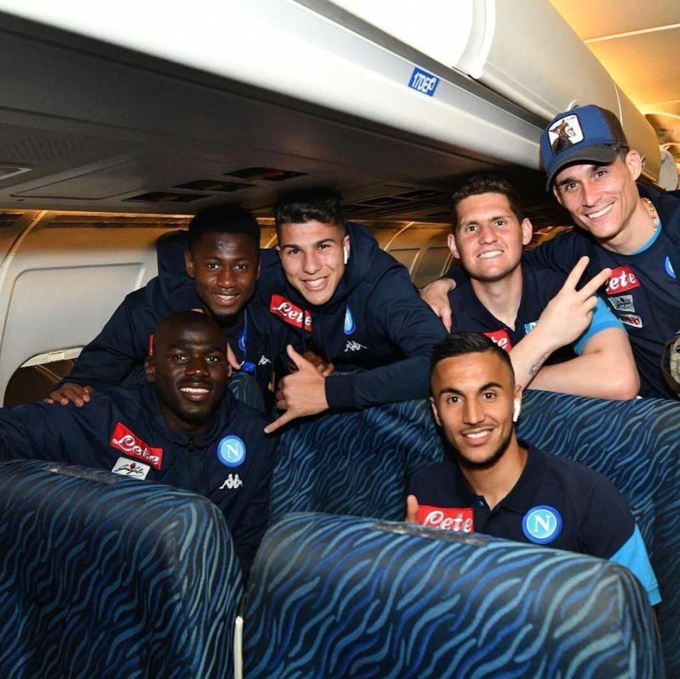 The players celebrate on the bus after beating Juventus in their back yard