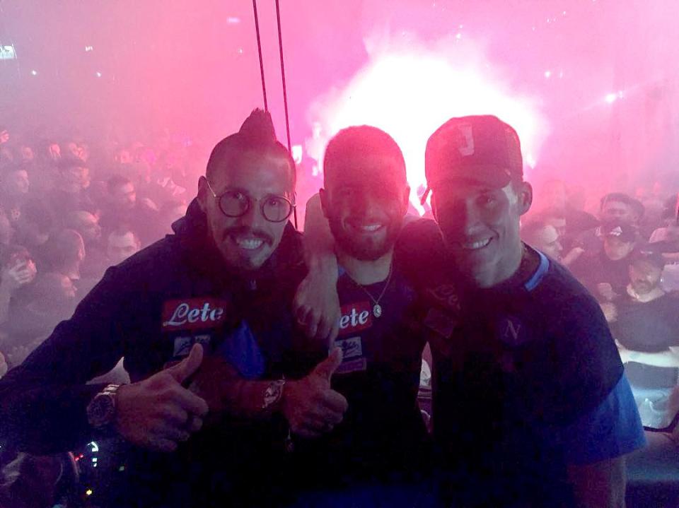 Marek Hamsik, Lorenzo Insigne and Jose Callejon celebrate in front of a wild crowd