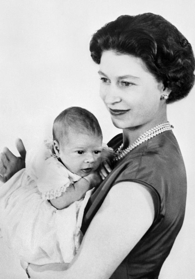  A tiny Prince Andrew nestles in Queen Elizabeth's arms in 1960