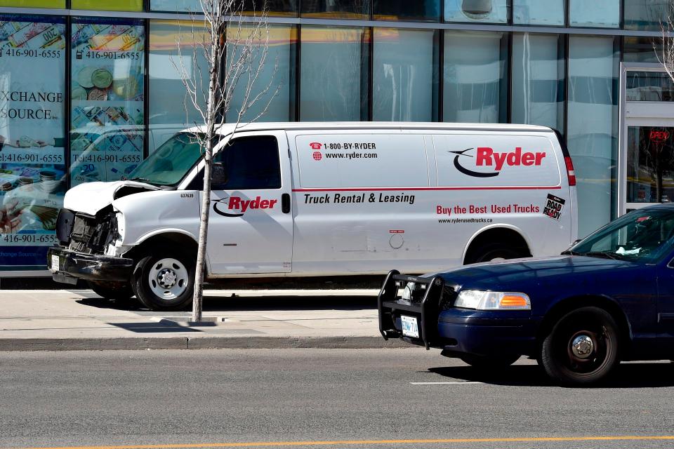  The white rental van that ploughed into pedestrians is seen smashed on the pavement