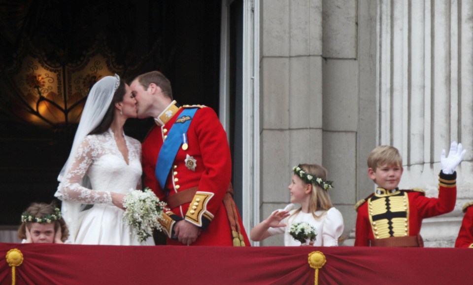 Prince William's goddaughter Grace Van Cutsem covered her ears during the fly past as the bride and groom shared a kiss