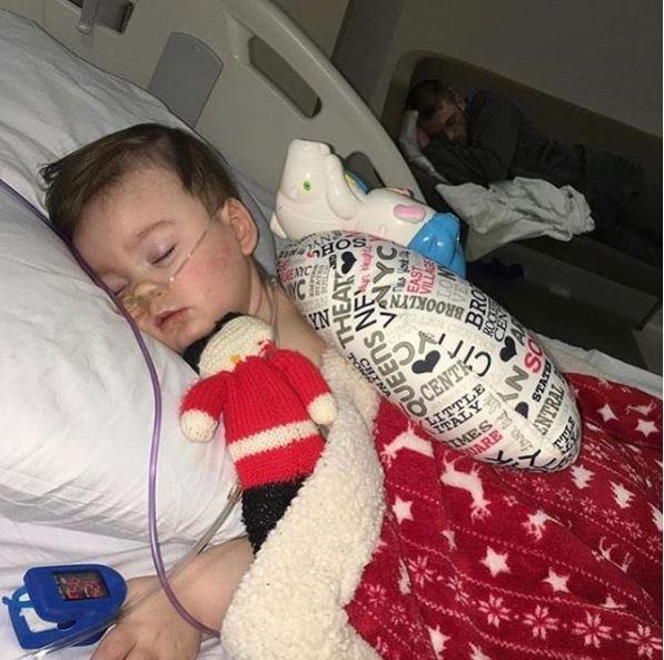  Little Alfie Evans is clinging to life in Alder Hey Hospital. He was pictured last night sleeping next to dad Tom