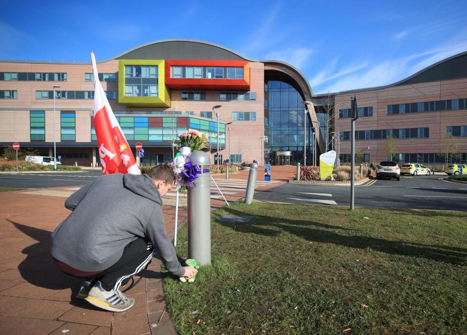  Another man leaves a cuddly toy in tribute to the brave tot outside the hospital