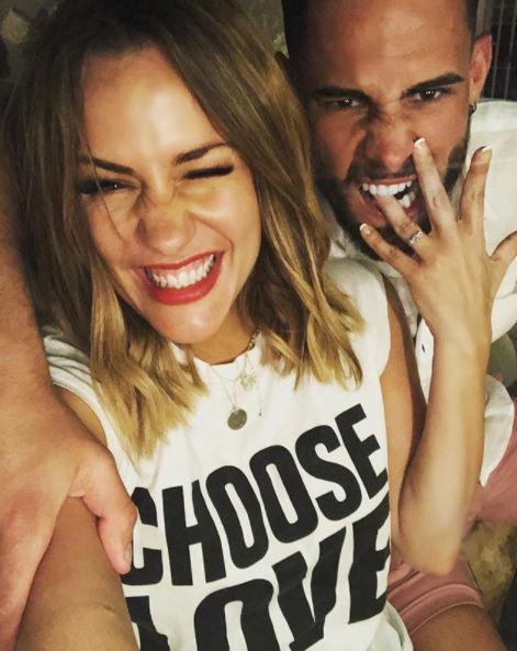  A friend of the couple said Caroline Flack is 'unquestionably happy' with Andrew Brady