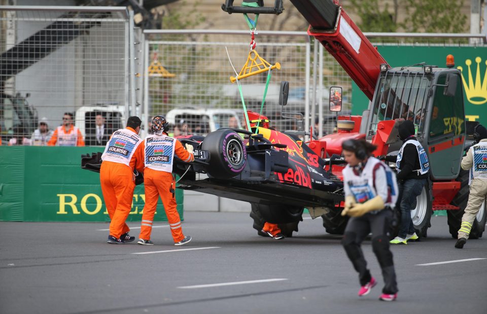 The crashed car of Max Verstappen is taken away during the Azerbaijan GP at Baku City Circuit 