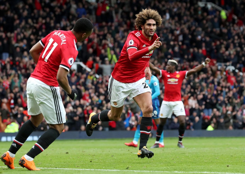 Marouane Fellaini celebrates his stoppage-time winner to tarnish what could be the last trip to Old Trafford as a manager for Arsene Wenger