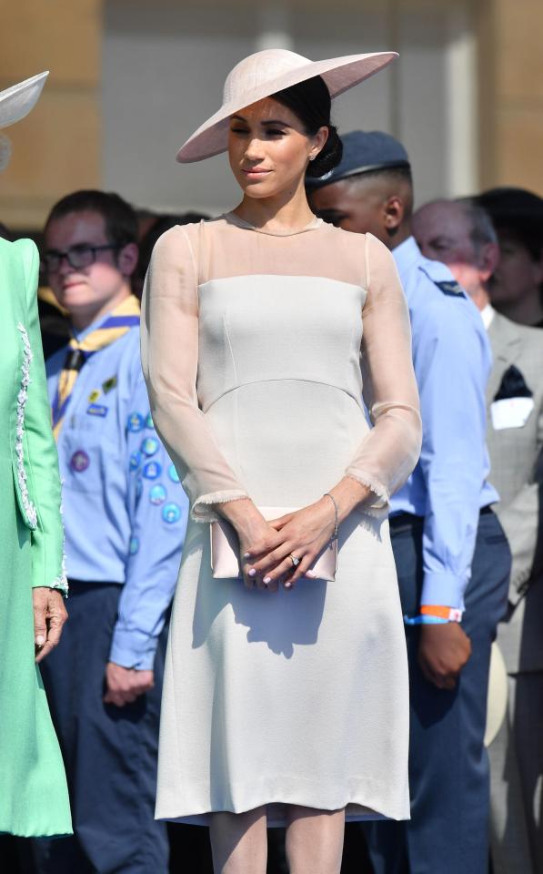  Meghan Markle has made her first post-wedding appearance at the Prince of Wales' 70th birthday in a rose pink dress