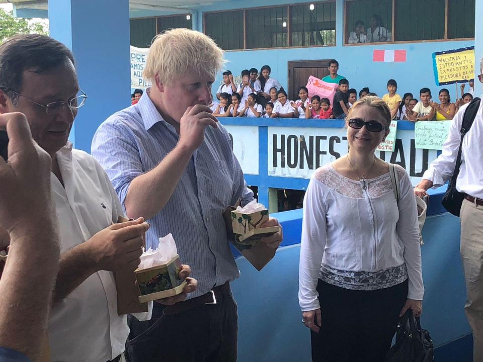  He was also snapped trying some of the area's local delicacies - with his Peruvian counterpart Nestor Popolizio