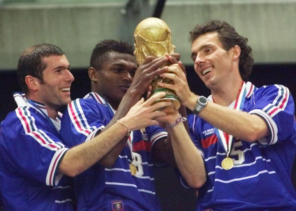 Blanc celebrates with the World Cup trophy in 1998