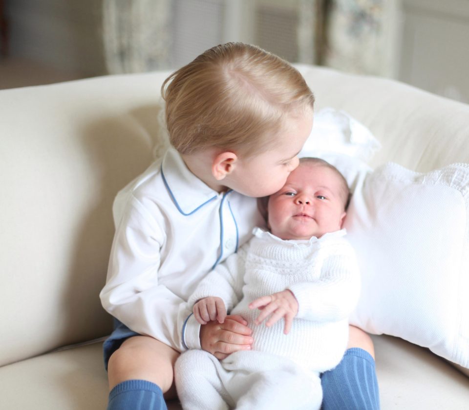  The caring prince plants a kiss on his little sister, as she would later do on their little brother Louis