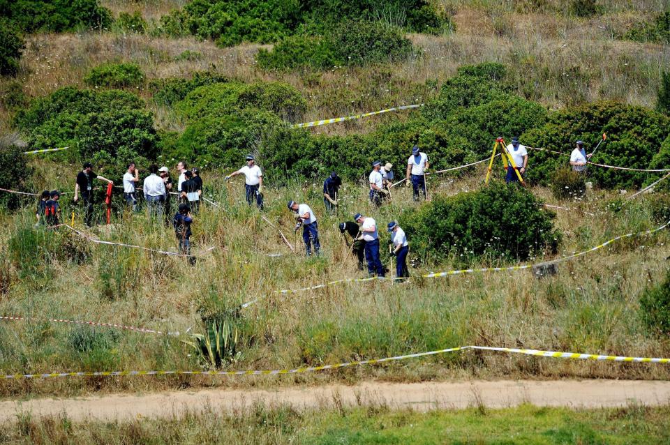  Police trawling through the surrounding area during the hunt for Madeleine